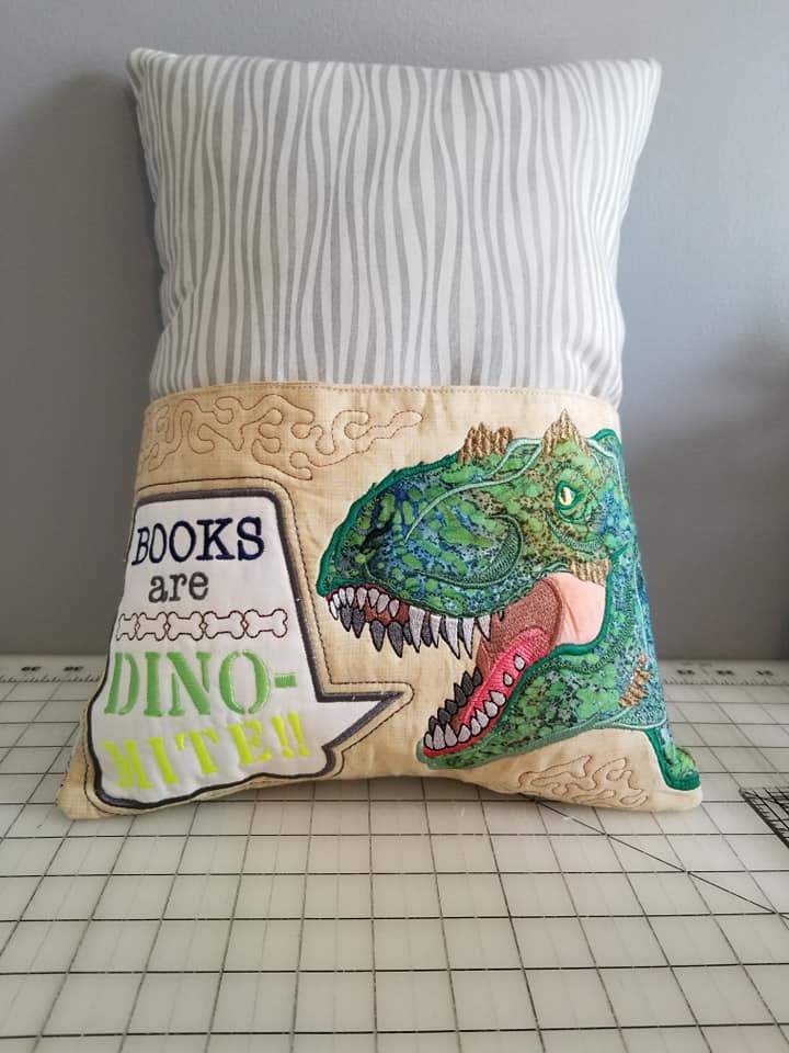 Dinosaur Reading Pillow 5x7 6x10 8x12 - Sweet Pea Australia In the hoop machine embroidery designs. in the hoop project, in the hoop embroidery designs, craft in the hoop project, diy in the hoop project, diy craft in the hoop project, in the hoop embroidery patterns, design in the hoop patterns, embroidery designs for in the hoop embroidery projects, best in the hoop machine embroidery designs perfect for all hoops and embroidery machines